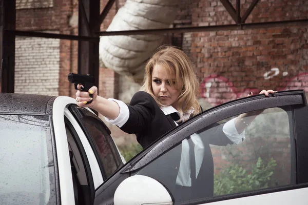 Noir film style woman in a black suit Royalty Free Stock Photos