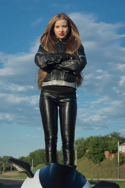 Sexy biker girl in a leather jacket — Stock Photo, Image