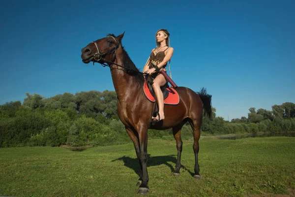 Wild amazon girl on horseback — Stock Photo, Image