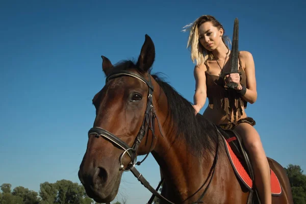 Wild amazon girl on horseback — Stock Photo, Image