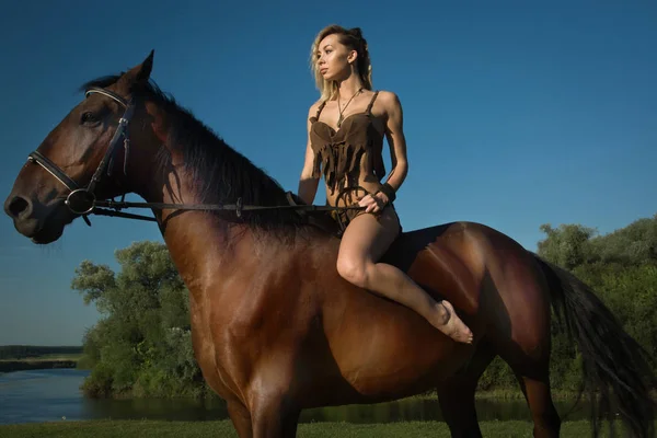 Wild amazon girl on horseback — Stock Photo, Image