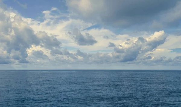 Open ocean and cloudy sky