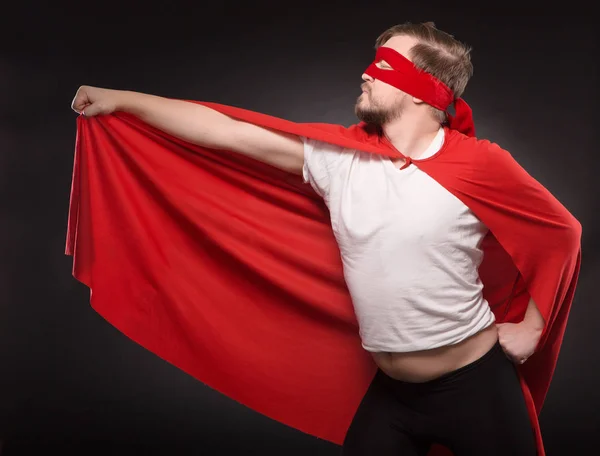 Jovem super herói homem no estúdio — Fotografia de Stock