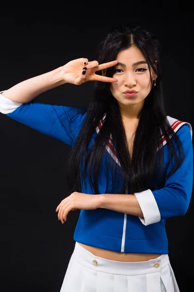 Asian woman expressing emotions in studio — Stock Photo, Image