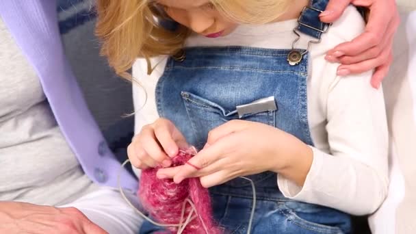 Grandmother and child knitting — Stock Video