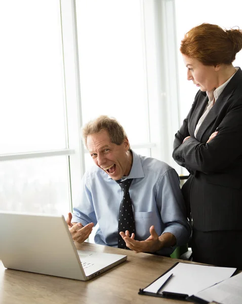 Angry boss screaming at workers — Stock Photo, Image