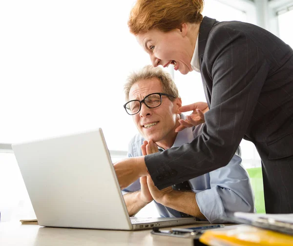 Angry boss screaming at workers — Stock Photo, Image