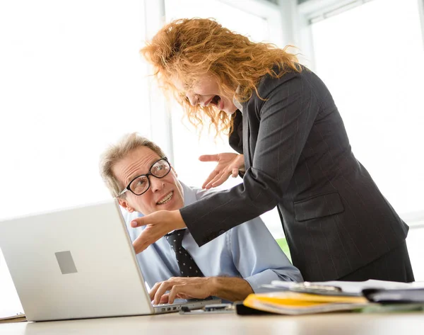 Angry boss screaming at workers — Stock Photo, Image