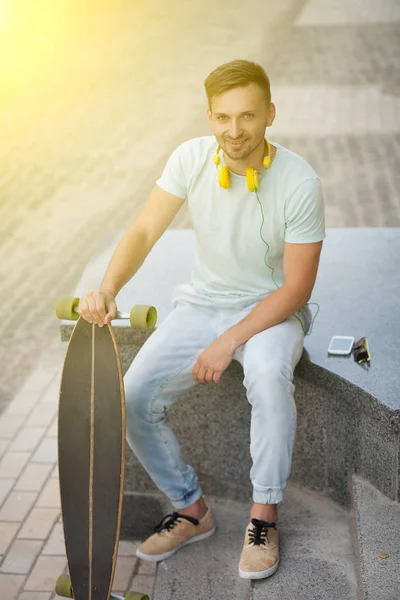 Young man with skate-board — Stock Photo, Image