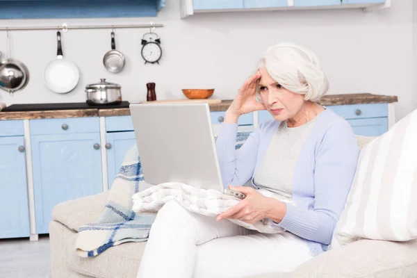 Grandmother using laptop computer — Stock Photo, Image