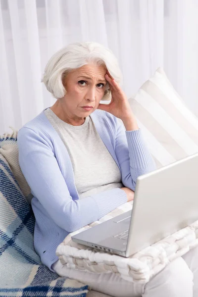 Grandmother using laptop computer — Stock Photo, Image