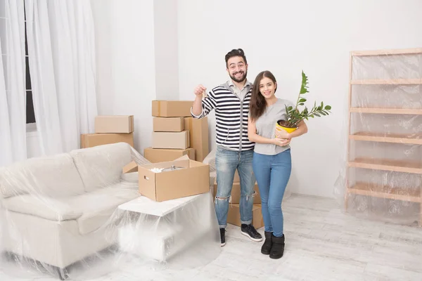 Young couple moving to new apartment.