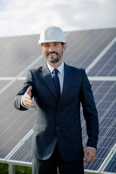 Business client at solar station happy and ready to handshake. — Stock Photo, Image