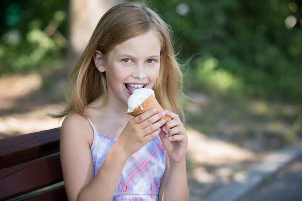 Little girl happy to eat ice cream.