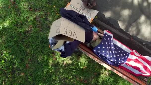 Top View Of Tramp Sleeping On Bench In The Street Stock Video