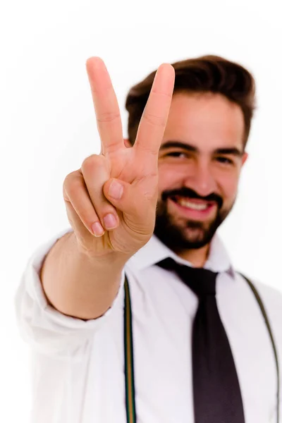 Hansome stylish brunette man showing victory with fingers. — Stock Photo, Image