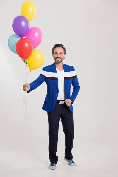 Harlecuin drôle avec des ballons — Photo