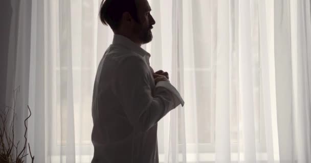 A handsome confident y man getting ready for work — Stock Video