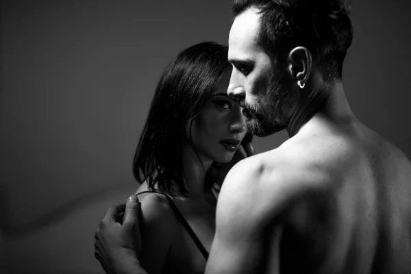 Young attractive couple in a twilight — Stock Photo, Image