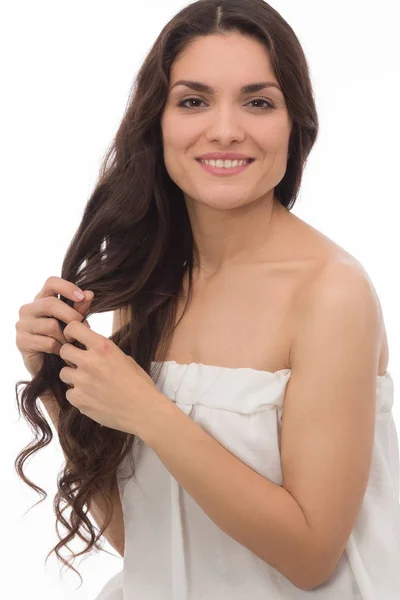 Pretty brunette woman wearing white dress — Stock Photo, Image