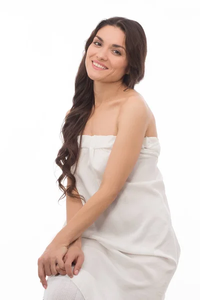 Pretty brunette woman wearing white dress — Stock Photo, Image