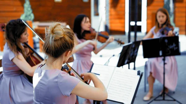 String Band Of Girls Musicians Play On Summer Terrace