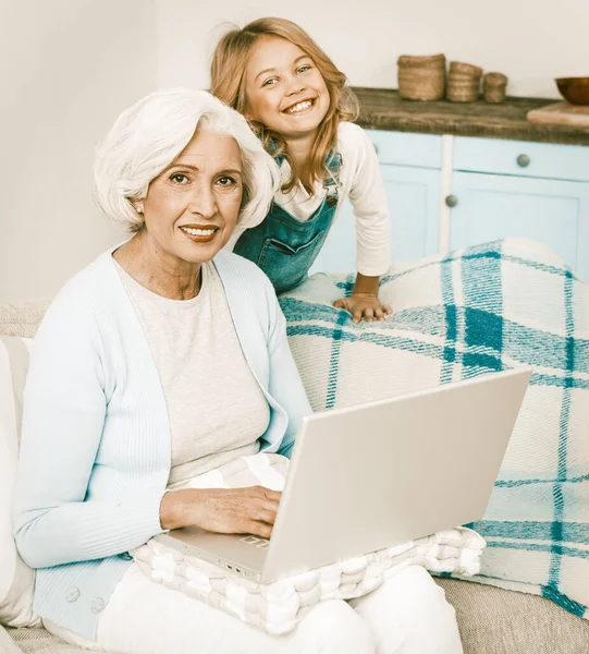 Grandmother And Little Grandchild Using Laptop At Home — ストック写真