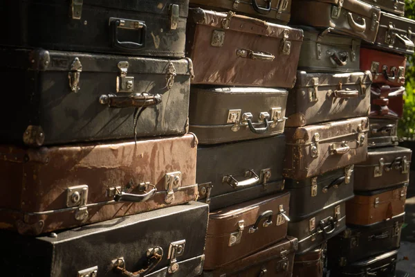 Vintage weathered leather suitcases on top of eachother — Stock fotografie