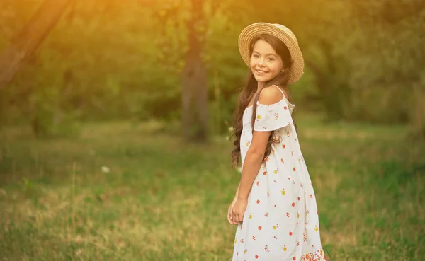 Smiling Girl Spinning in White Dress in Garden. — ストック写真