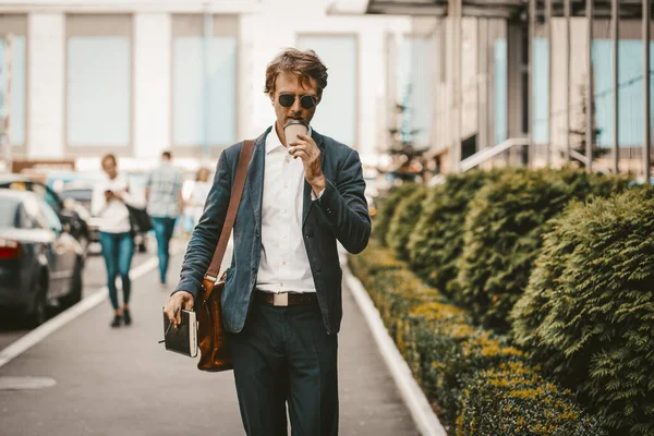 Young businessman having a coffee on the way to work or client — 스톡 사진