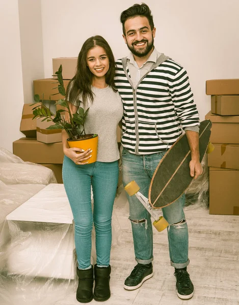Lovely couple standing in newly bought apartment. — Stockfoto
