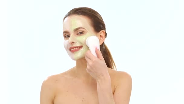 Young Beautiful Model Applying Face Mask With Face Massager — Stock videók