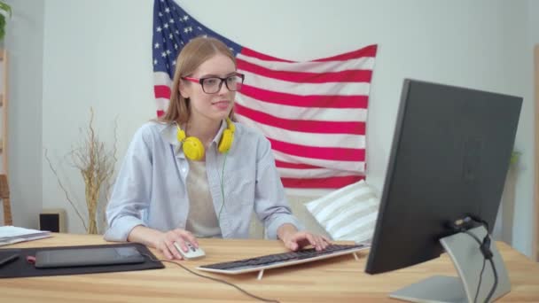 Young lady working with a computer at home — Stock Video