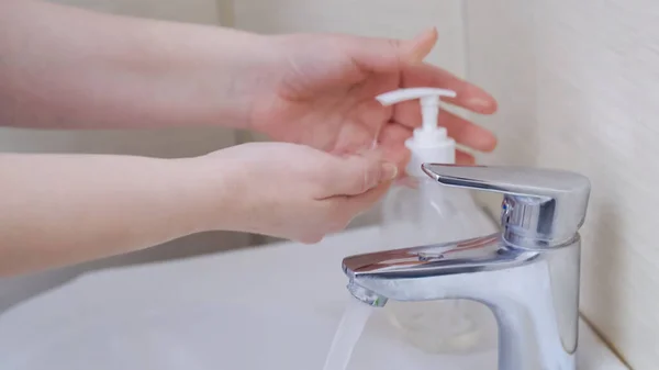 Woman Puts Antibacterial Soap On Her Hands — Stock Photo, Image