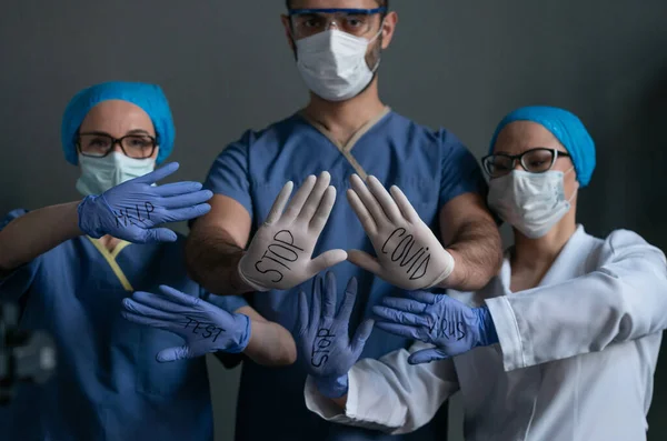 Doctors With Inscriptions On Disposable Gloves — Stok Foto