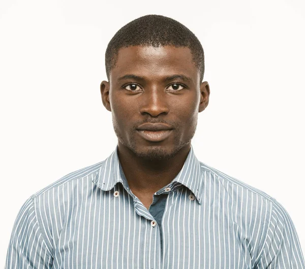 Attractive Dark-skinned guy looks confident. African american serious man isolated on white background. Toned image — Stock Photo, Image