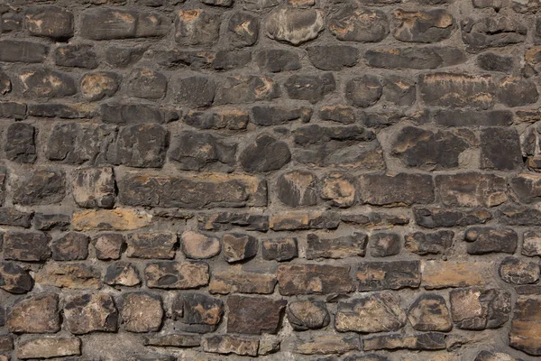 Ancient brick stone wall. Antique brown brick wall. Texture and background — Stock Photo, Image