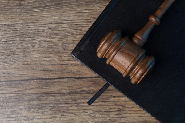 Judges hammer on black notebook — Stock Photo, Image