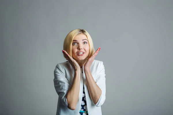 Unhappy girl on empty background — Stock Photo, Image