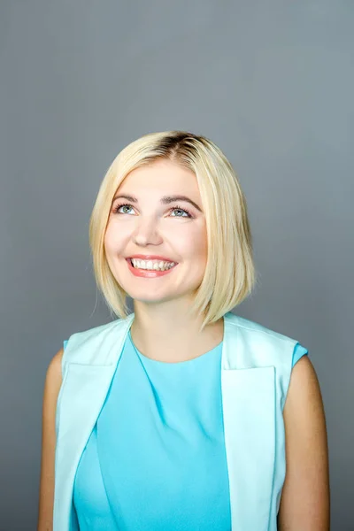 Girl at empty gray background — Stock Photo, Image