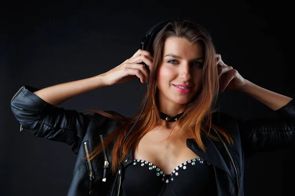 Picture of beautiful girl in headphones with leather jacket — Stock Photo, Image