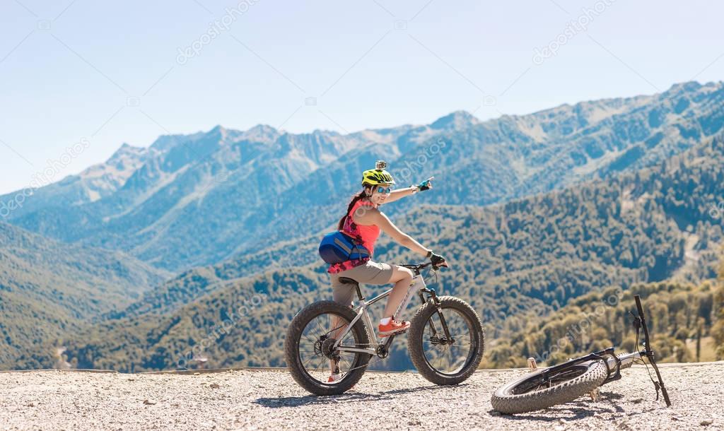 Photo of girl in helmet at bicycle