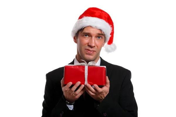 Foto de hombre joven en traje de negocios, gorra de Santa con regalos en caja —  Fotos de Stock