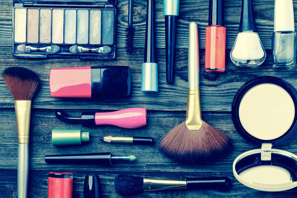 Cosmetics set on wooden background