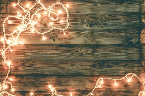 Christmas and new year dark brown wooden background decorated li — Stock Photo, Image