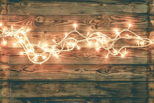 Festoon on brown wooden background — Stock Photo, Image