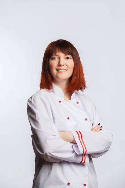 Picture of female chef in white robe with arms crossed at waist — Stock Photo, Image