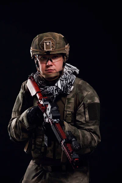 Image of military man in safety glasses with gun in his hand — Stock Photo, Image