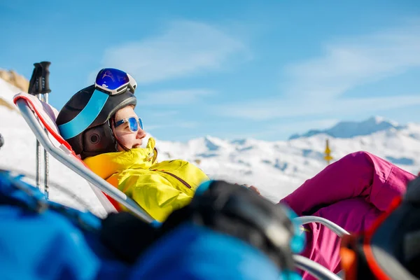 Image of smiling sportswoman lying on winter deckchair — Stock Photo, Image