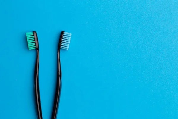 Black toothbrushes , place for inscription — Stock Photo, Image